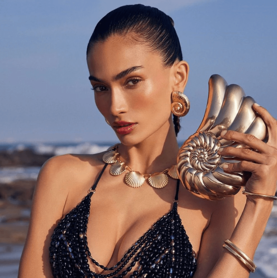 Olga Berg SHELLA HARD GOLD CLUTCH Handbags | Shop now at Main & Taylor Shoes!