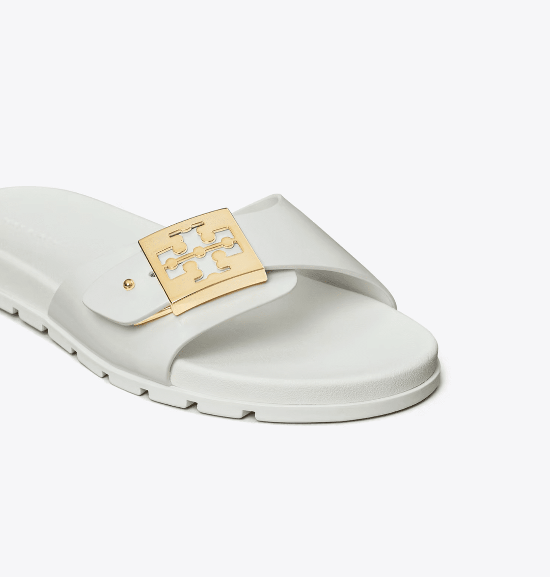 TORY BURCH MELLOW BUCKLE WHITE GOLD SLIDE SHOES | Shop now at Main &amp; Taylor Shoes!