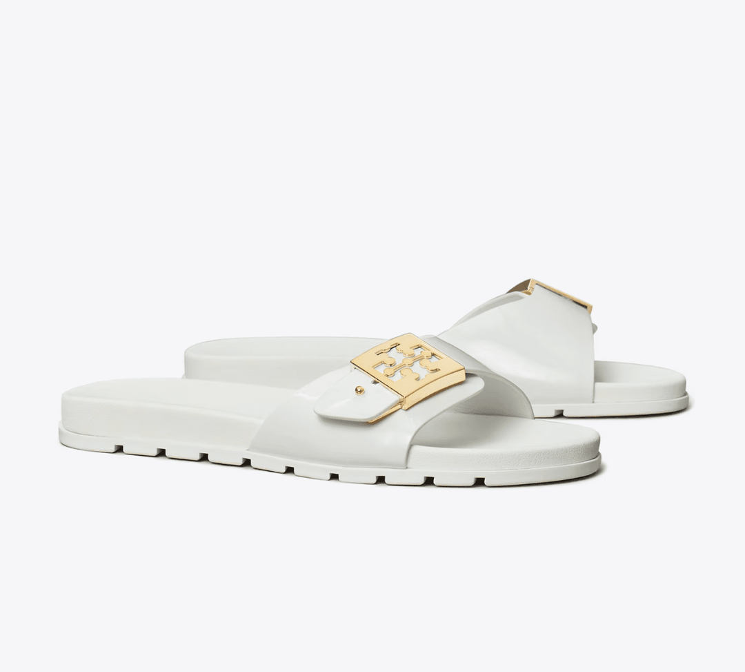 TORY BURCH MELLOW BUCKLE WHITE GOLD SLIDE SHOES | Shop now at Main & Taylor Shoes!