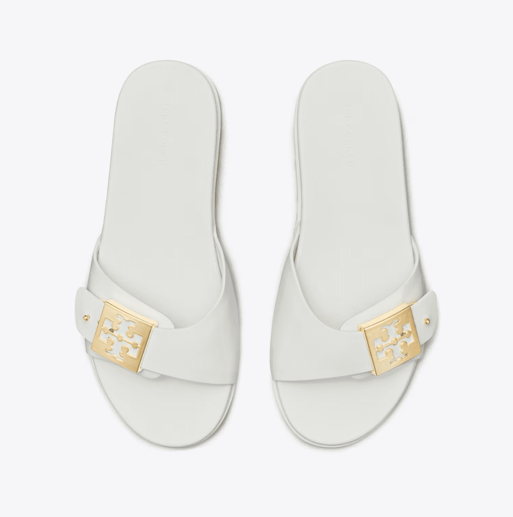 TORY BURCH MELLOW BUCKLE WHITE GOLD SLIDE SHOES | Shop now at Main & Taylor Shoes!