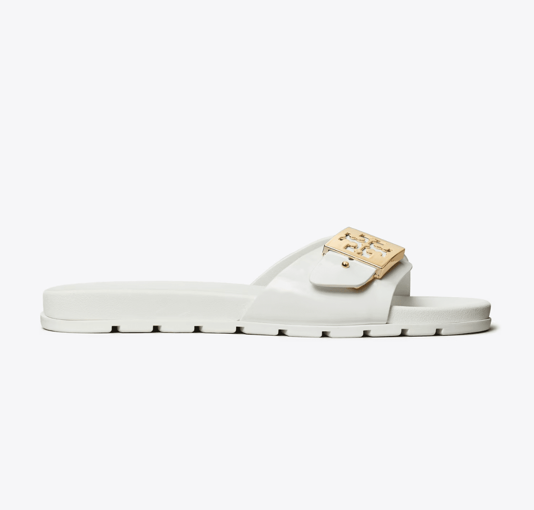 TORY BURCH MELLOW BUCKLE WHITE GOLD SLIDE SHOES | Shop now at Main &amp; Taylor Shoes!
